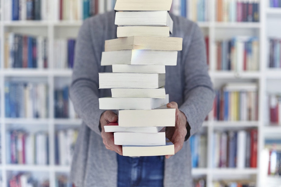 caption: Balancing stack of books. Photo by Getty Images