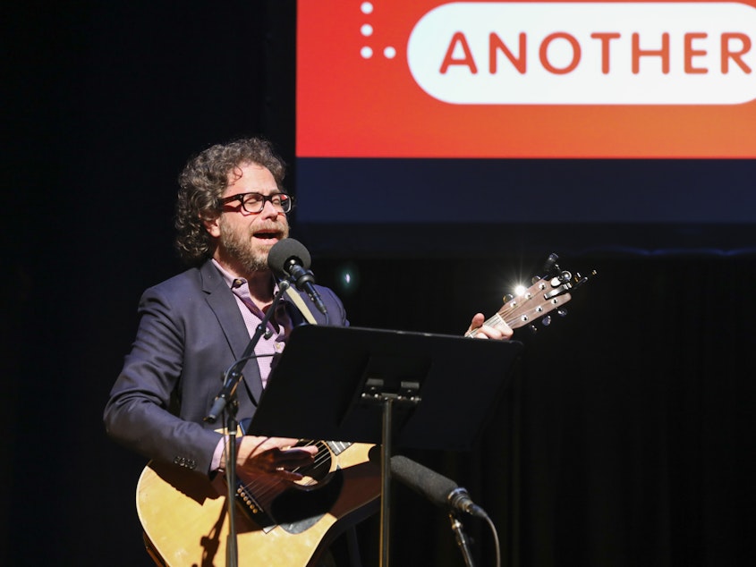 caption: <em>Ask Me Another</em>'s house musician Jonathan Coulton leads a music parody game at TPAC's Polk Theater in Nashville, Tennessee.