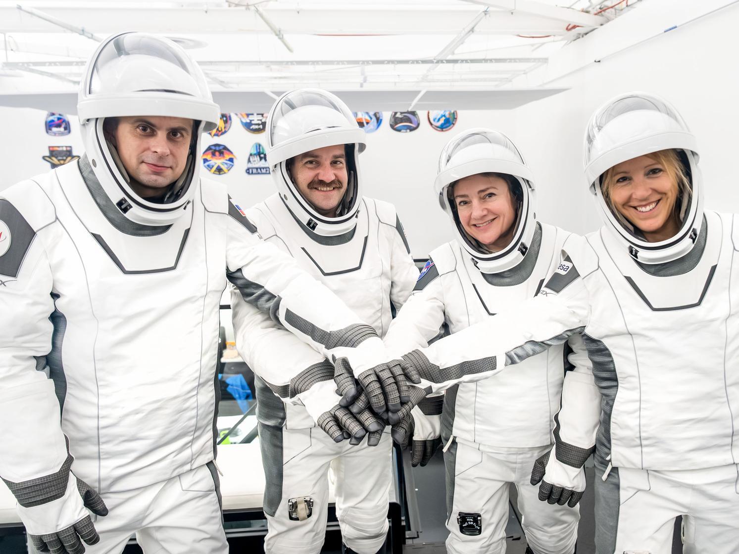 caption: The four members of NASA's SpaceX Crew-12 mission pose for a portrait at SpaceX headquarters in Hawthorne, Calif. From left: Russian cosmonaut and Mission Specialist Andrey Fedyaev, NASA astronauts Jack Hathaway and Jessica Meir, pilot and commander respectively, and European Space Agency astronaut and Mission Specialist Sophie Adenot.