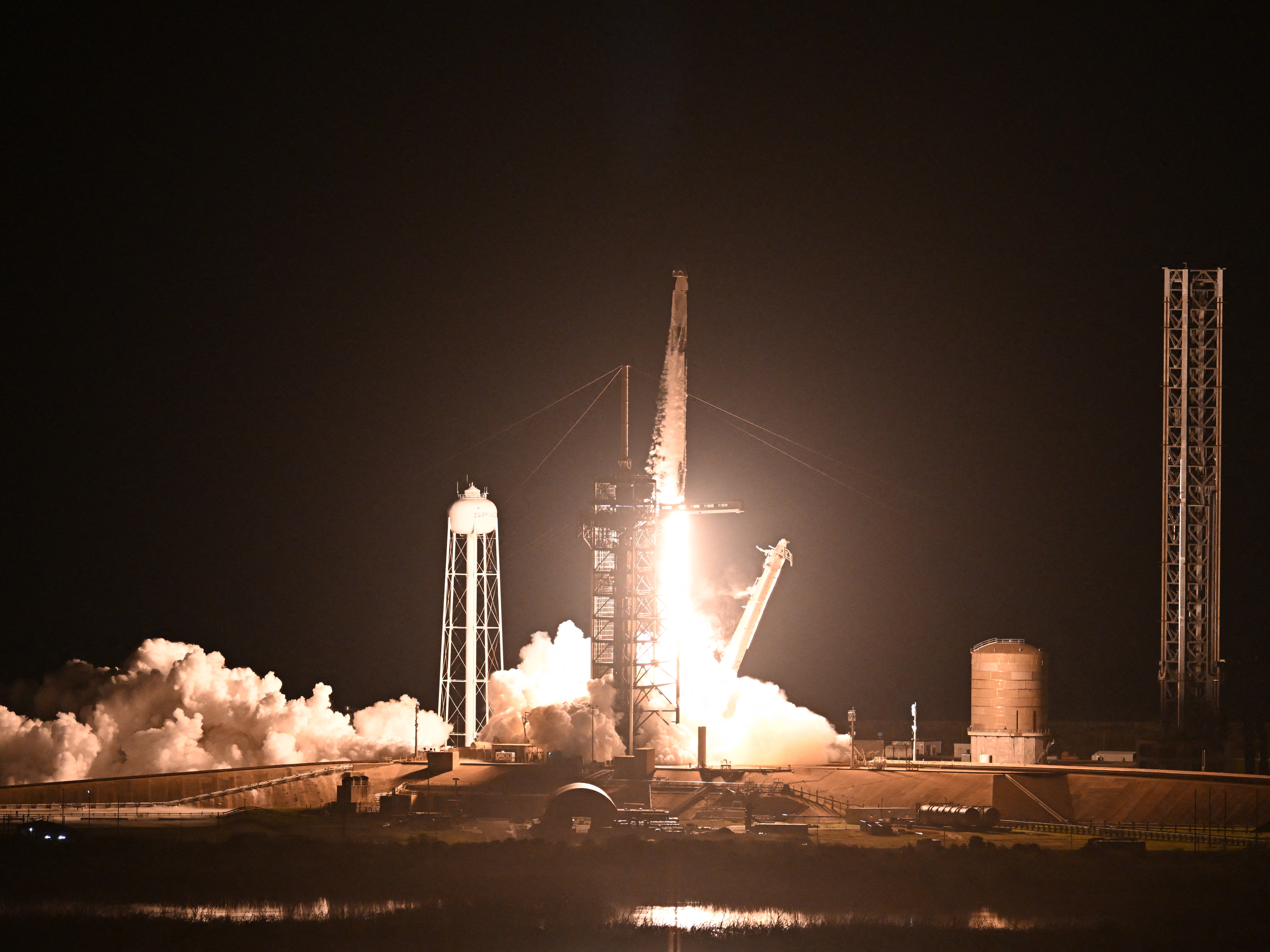 caption: A SpaceX Falcon 9 rocket with the Crew Dragon Endeavour capsule carrying the Crew-8 mission launches from launch pad 39A at NASA's Kennedy Space Center in Florida on March 3, 2024.