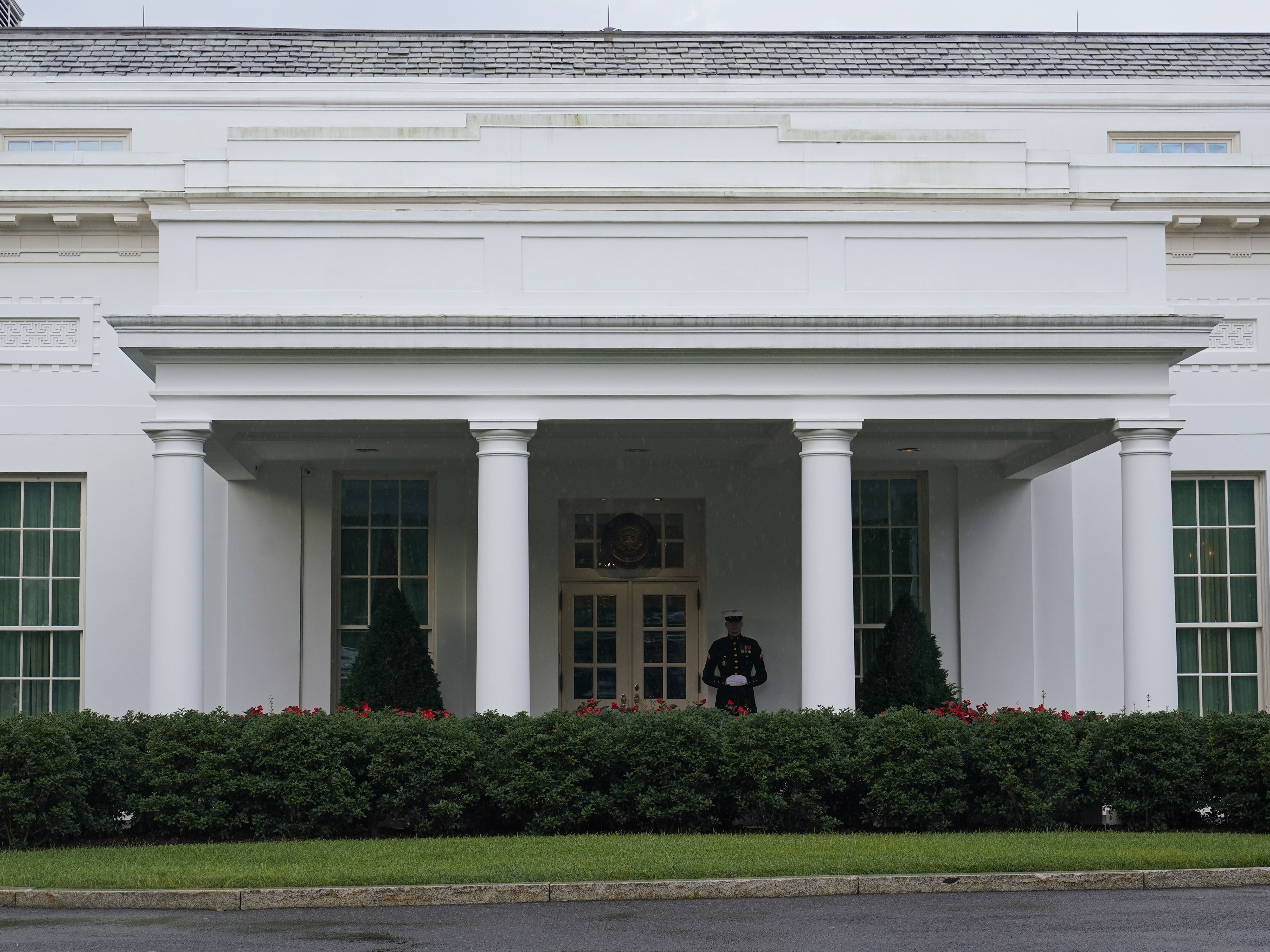 caption: The West Wing of the White House on July 5, 2023. Tech executives are meeting with top Biden administration officials on Tuesday to agree to voluntary measures to reduce risks posed by AI.