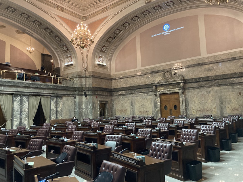 caption: The Washington Senate chamber sits empty before the start of the legislative session on January 11. Senate Democrats are taking the lead this year on a decade-long effort to pass a capital gains tax in Washington. 