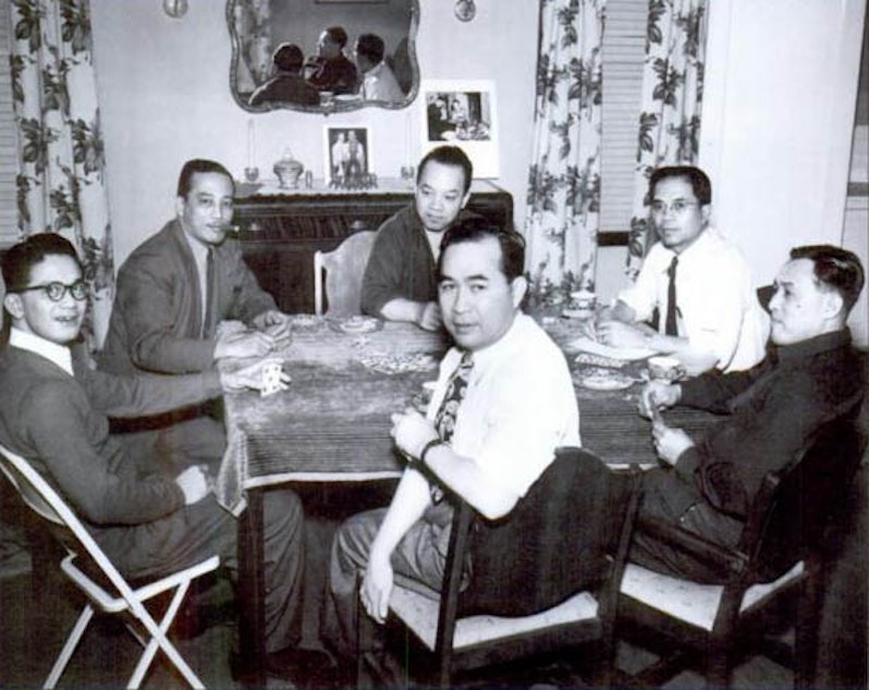 caption: Almanzor Guido is in the center at the back. He enjoyed bringing people together at his home. 