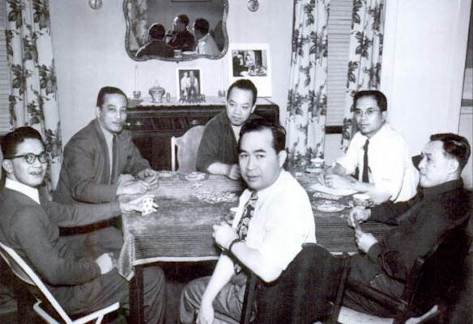 caption: Almanzor Guido is in the center at the back. He enjoyed bringing people together at his home. 