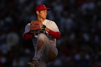 caption: Shohei Ohtani, #17 of the Los Angeles Angels, pitches during a game against the Los Angeles Dodgers at Angel Stadium on June 21, in Anaheim, Calif.