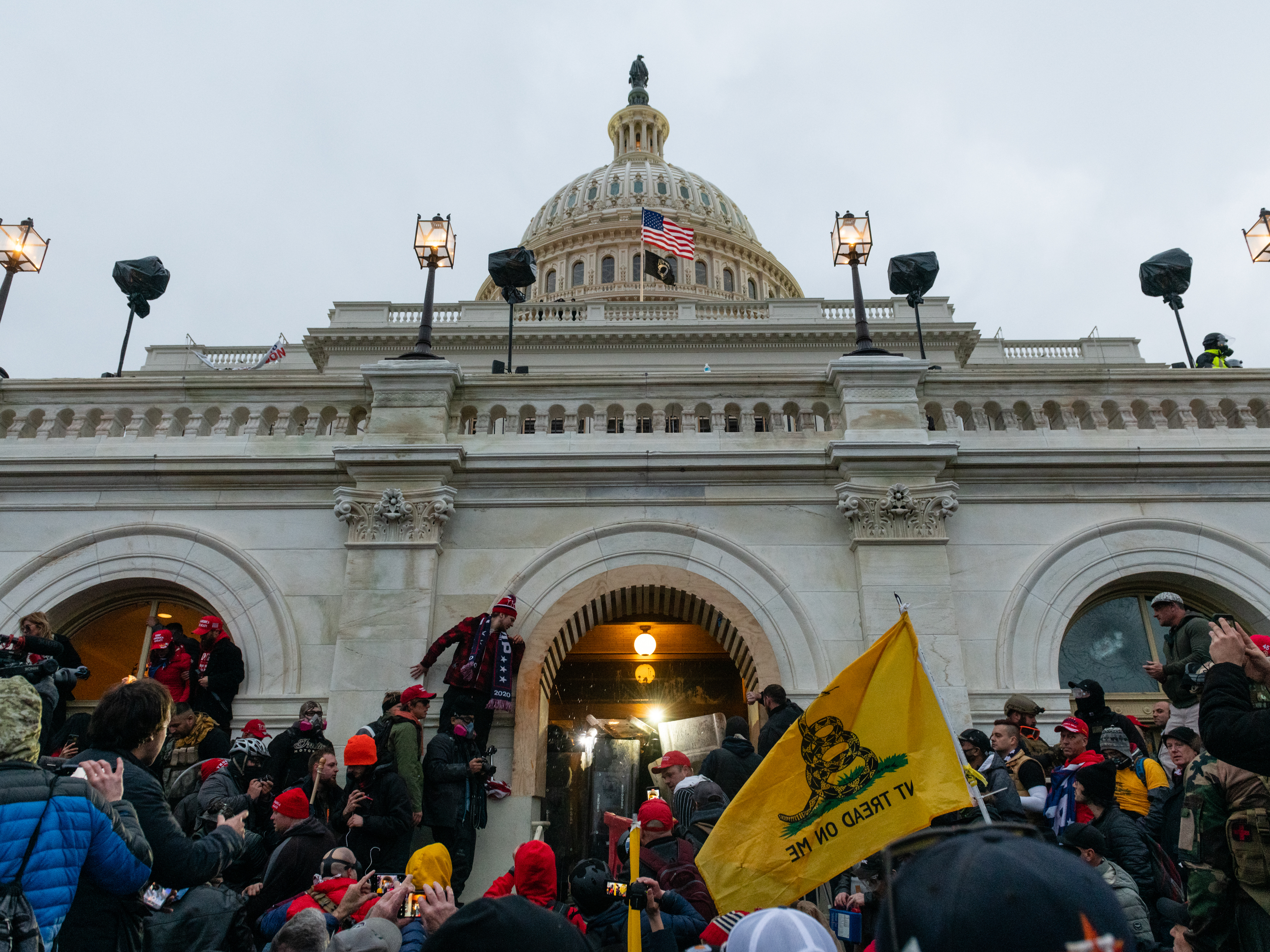 caption: Rioters clash with law enforcement as they attempt to enter the U.S. Capitol on Jan. 6.