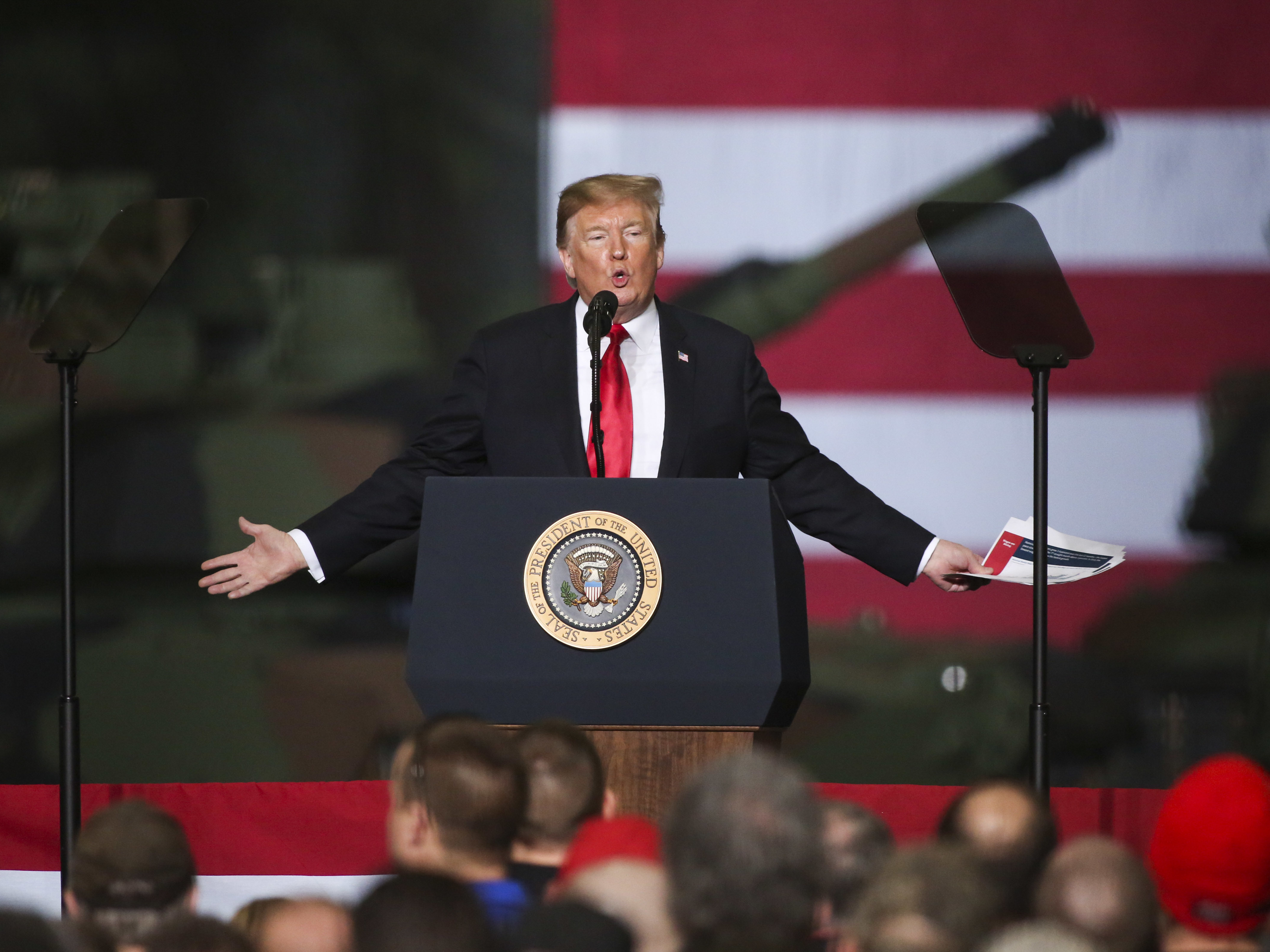 caption: President Trump speaks at the Joint Systems Manufacturer on Wednesday in Lima, Ohio. Trump visited the northeastern Ohio defense manufacturing plant to discuss his successes in the economy, job growth, John McCain and ISIS.