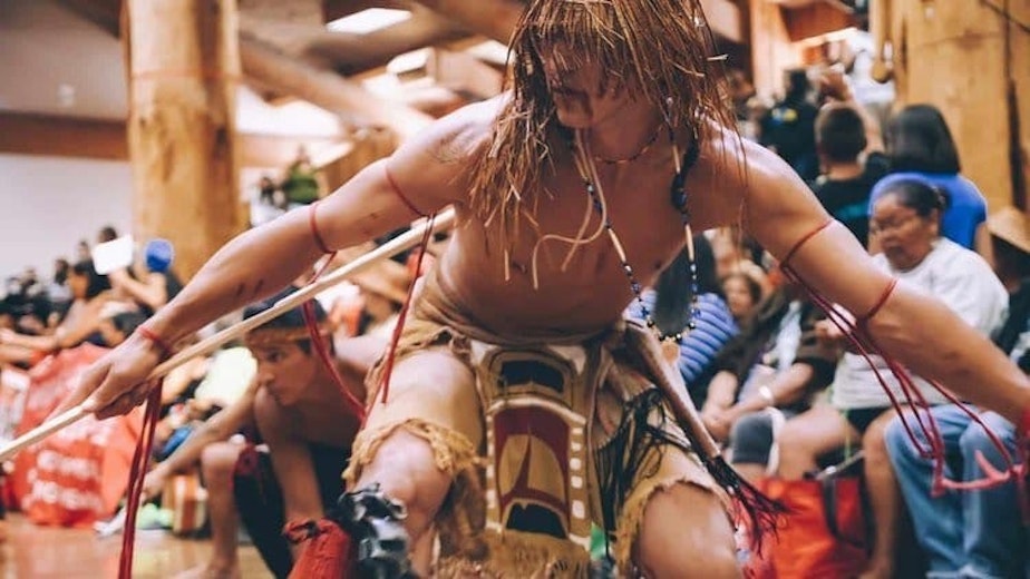 caption: A performance by Children of the Setting Sun.