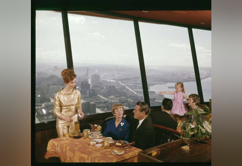 caption: Diners at the Eye of the Needle restaurant at the top of the Space Needle, Seattle World's Fair, 1962