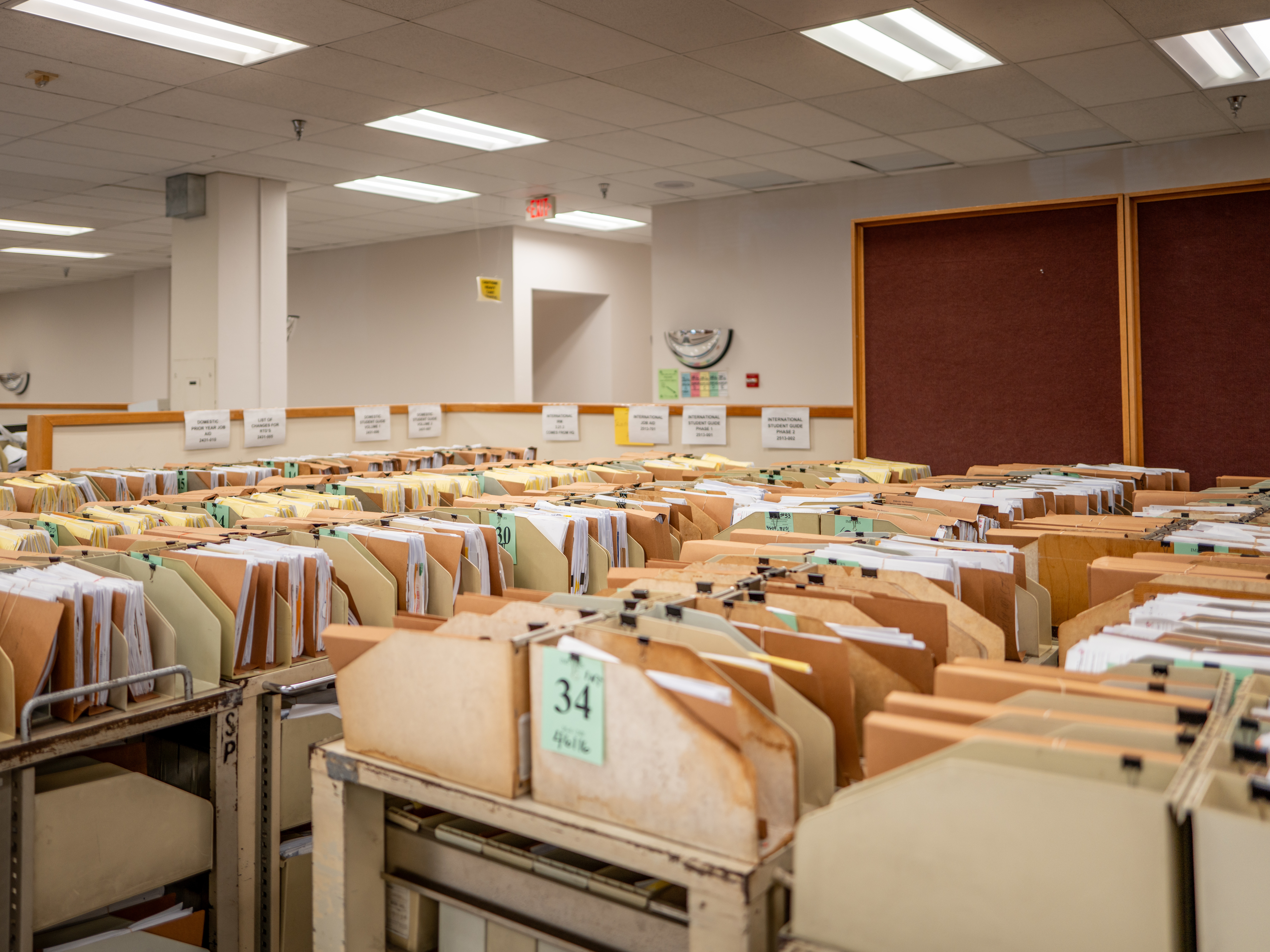 caption: The IRS says it processed 11.7 million tax returns in the first week of the 2025 filing season. Here, carts loaded with documents are seen at an IRS processing facility in Austin, Texas, last September.