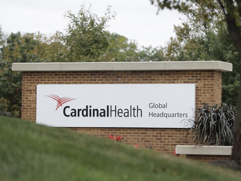 caption: Cardinal Health is one of four of the biggest American health companies have tentatively agreed to pay $26 billion to settle their opioid liability. But tax breaks could allow them to claw back $4 billion.