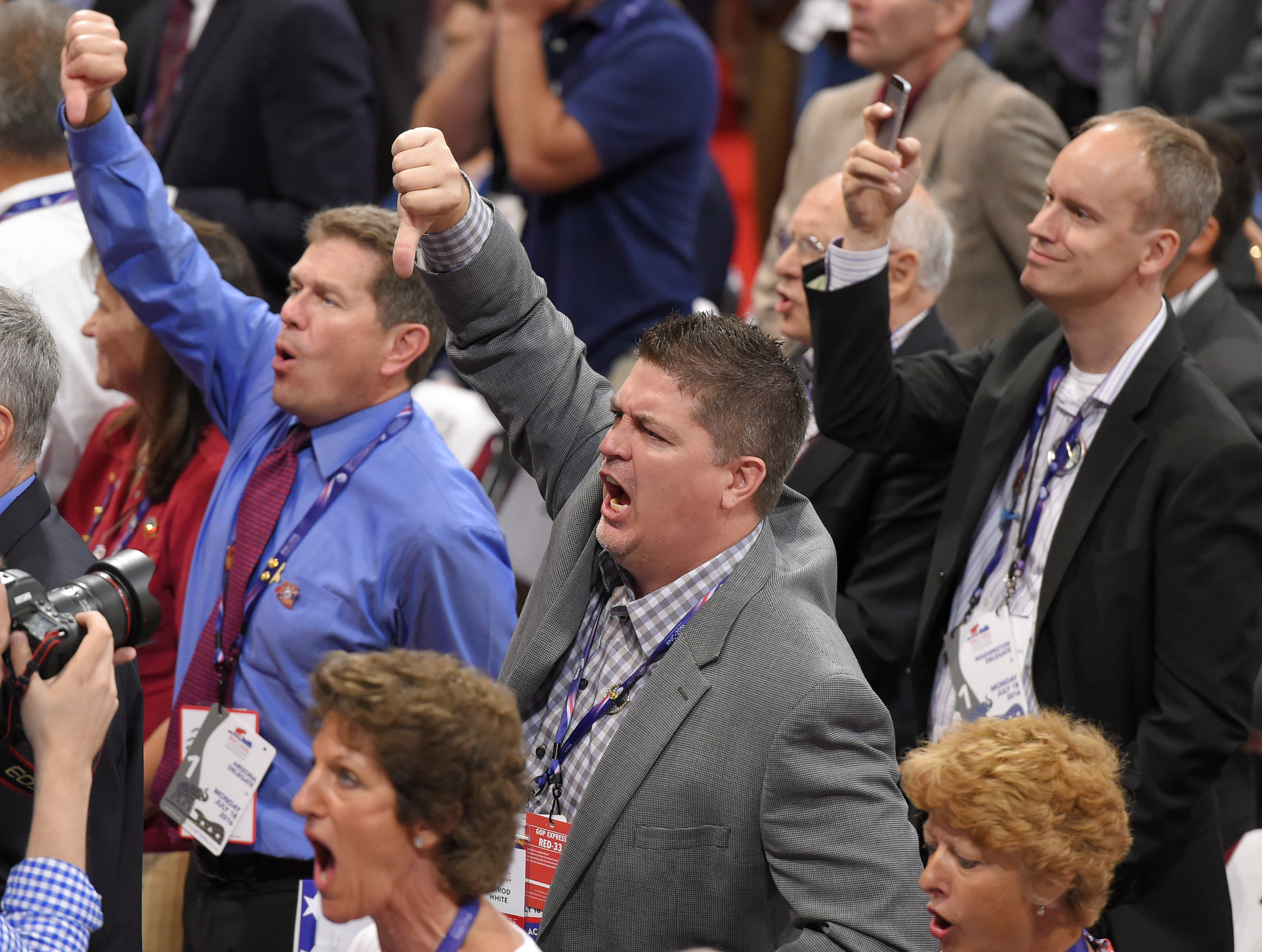 caption: Delegates react as some delegates call for a roll call vote on the adoption of the rules during the opening day of the Republican National Convention in Cleveland, Monday, July 18, 2016.