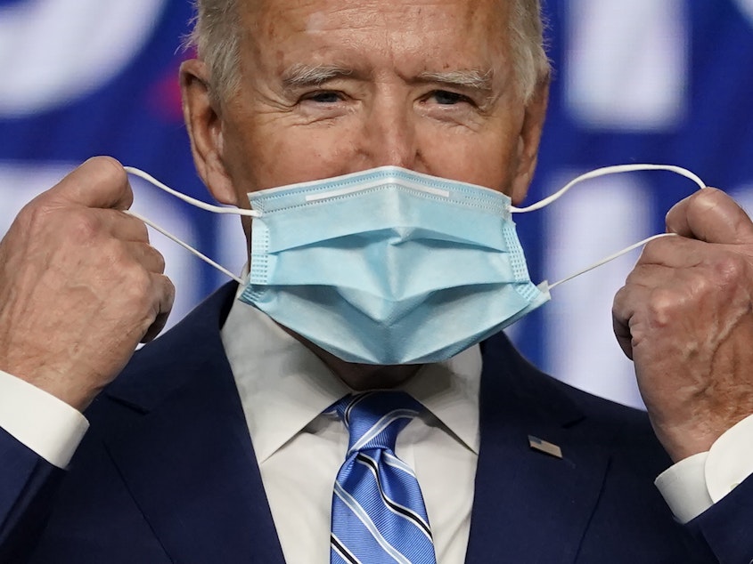 caption: President Joe Biden, pictured on the campaign trail in Nov. 2020, has long encouraged Americans to mask up in the fight against COVID-19. On Wednesday, his administration announced it will provide 25 million masks to community health centers and food banks across the country.
