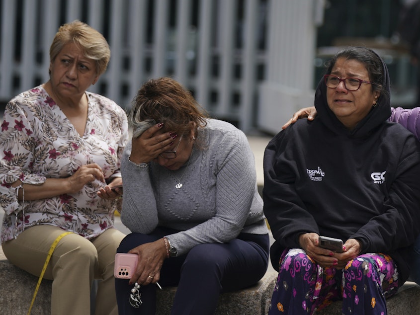 caption: People gather outside after a magnitude 7.6 earthquake was felt in Mexico City on Monday, Sept. 19. The quake hit at 1:05 p.m. local time, according to the U.S. Geologic Survey, which said the quake was centered near the boundary of Colima and Michoacan states.