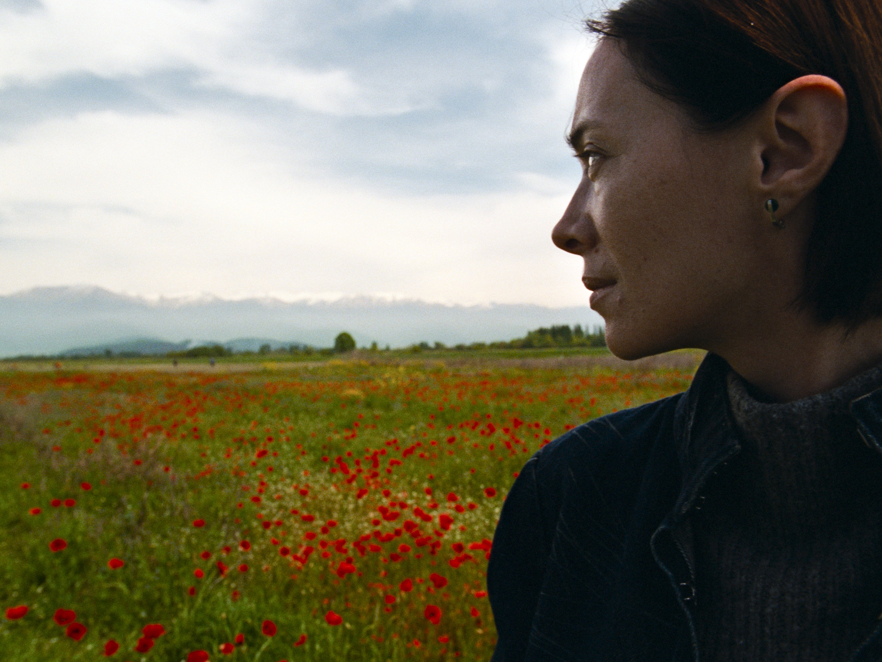 caption: Ia Sukhitashvili plays Nina, an obstetrician who performs abortions in rural Georgia, at the foot of the Caucasus Mountains in Dea Kulumbegashvili's film <em>April</em>.