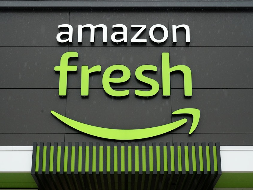 caption: An Amazon Fresh grocery store is seen, Feb. 4, 2022, in Warrington, Pa. Amazon is removing Just Walk Out technology from its Amazon Fresh stores as part of an effort to revamp the grocery chain.