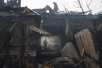 caption: <strong>April 11:</strong> Firefighters work to extinguish a fire resulting from a Russian attack at a house in Kharkiv, in eastern Ukraine.