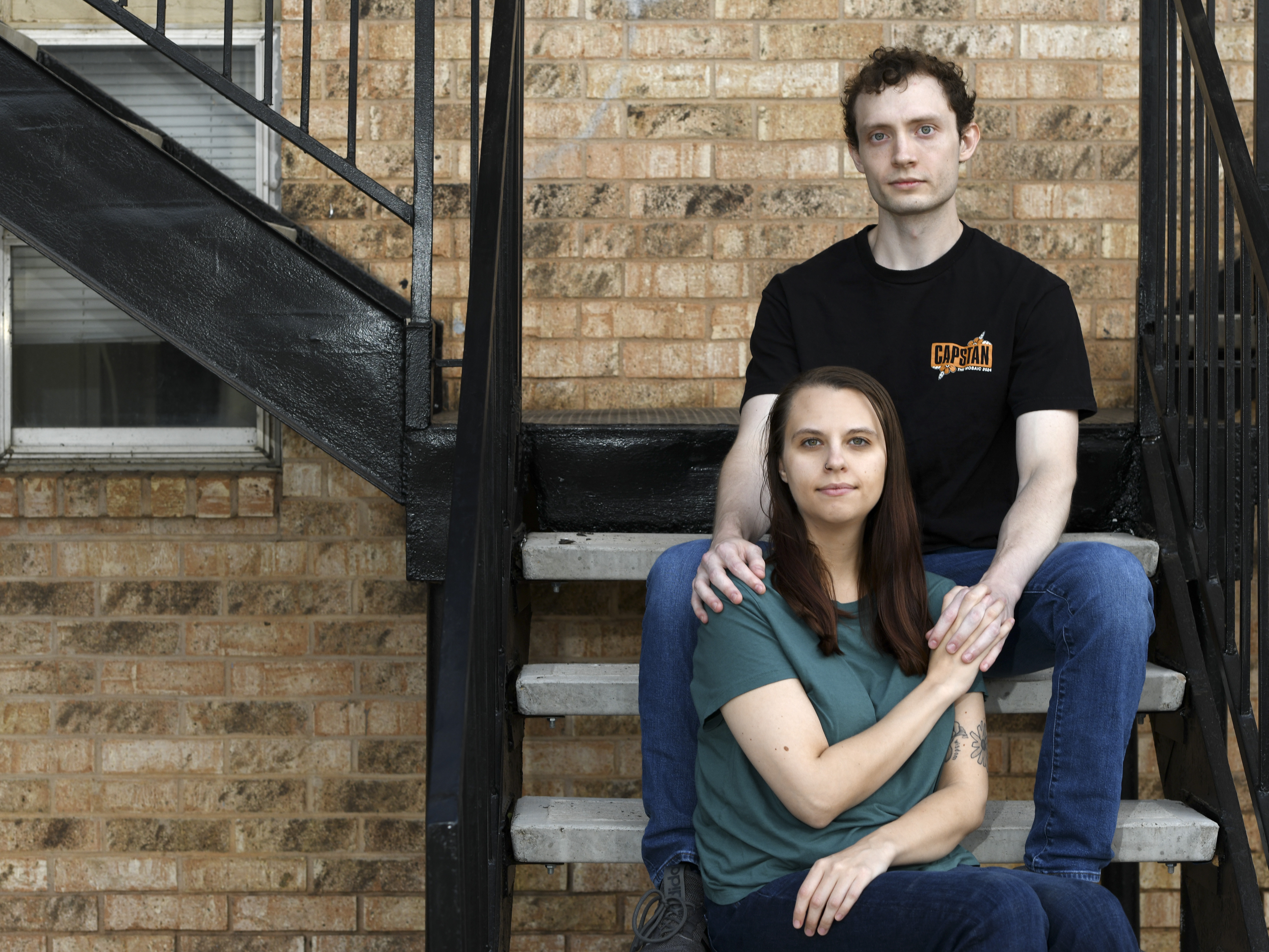 caption: Dakota Heath, 26, and Jordyn Glick, 27, at their apartment building in Lubbock, Texas. Heath takes care of Glick, who has an unpredictable and painful gastrointestinal disorder. Roughly a quarter of family caregivers are young adults.