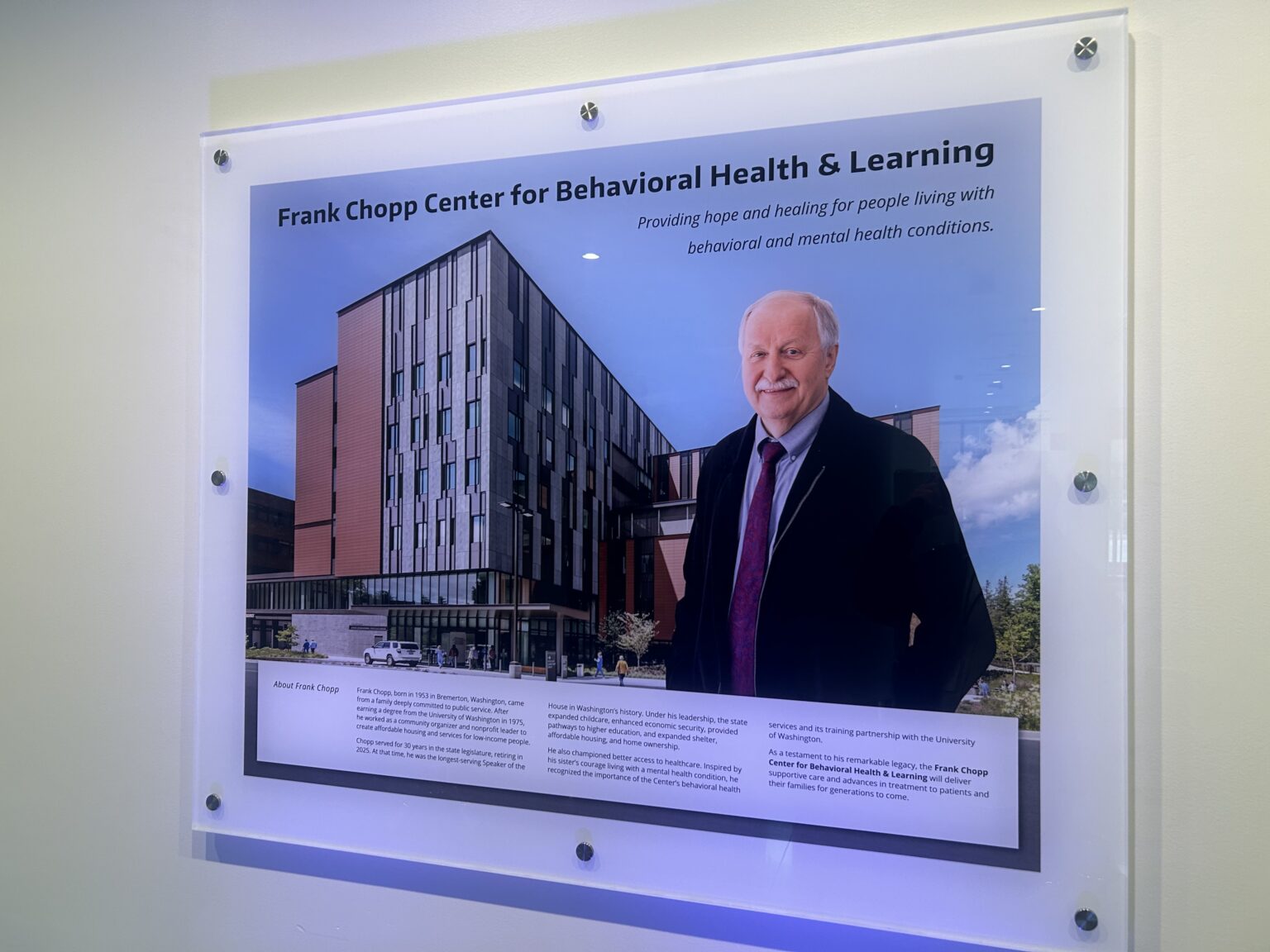 caption:  Signage honors Frank Chopp in the lobby of the University of Washington psychiatric teaching hospital dedicated to him on Tuesday, April 28, 2026, in Seattle.