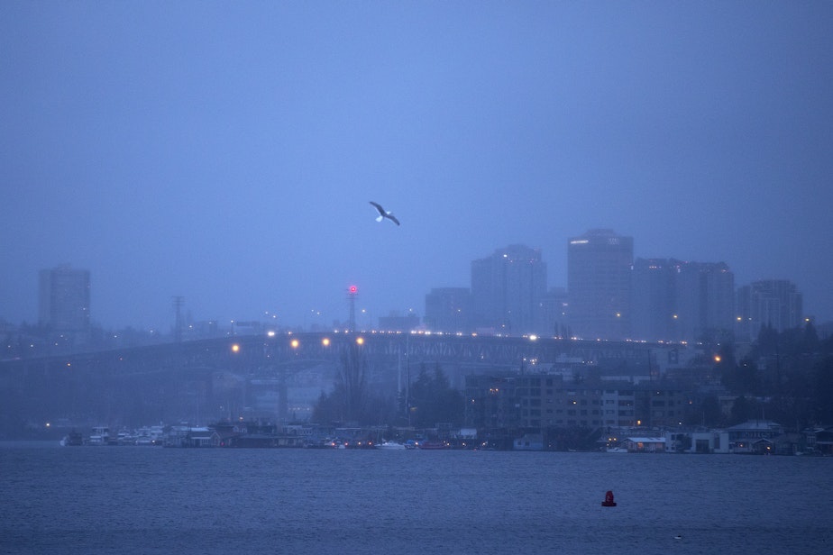 caption: Early morning traffic is visible I-5, on Tuesday, February 25, 2025, from South Lake Union in Seattle.