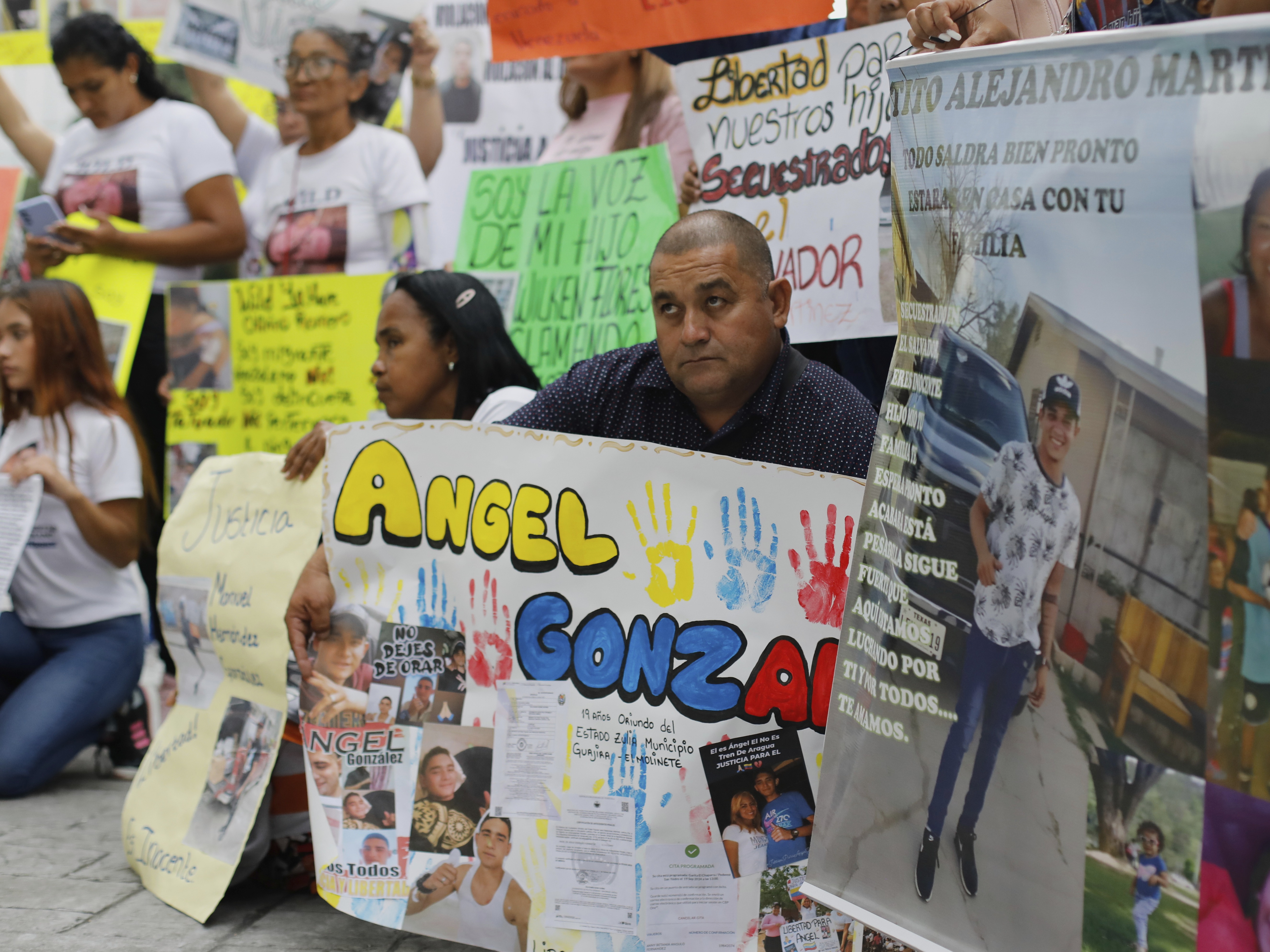 caption: Relatives of Venezuelan migrants in the U.S. who were flown to a prison in El Salvador by the U.S. government, which alleged they were members of the Tren de Aragua gang, protest outside the United Nations building in Caracas, Venezuela, Tuesday, April 22, 2025.
