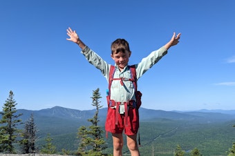 caption: In this July 23, 2021 family photo, 5-year-old Harvey Sutton raises his arms while hiking the Appalachian Trail with his parents, Josh and Cassie Sutton.