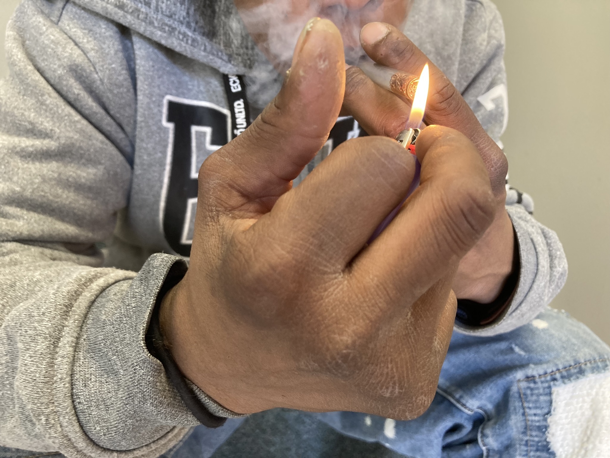 caption: A middle-aged man smoking crack cocaine in Rhode Island. The state had the country’s fourth-highest rate of overdose deaths involving cocaine in 2022. 
