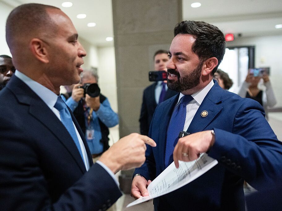 caption: Rep. Mike Lawler (right), R-N.Y., confronts House Minority Leader Hakeem Jeffries, D-N.Y., about signing on to a bill that would extend Affordable Care Act tax credits, on Oct. 8.