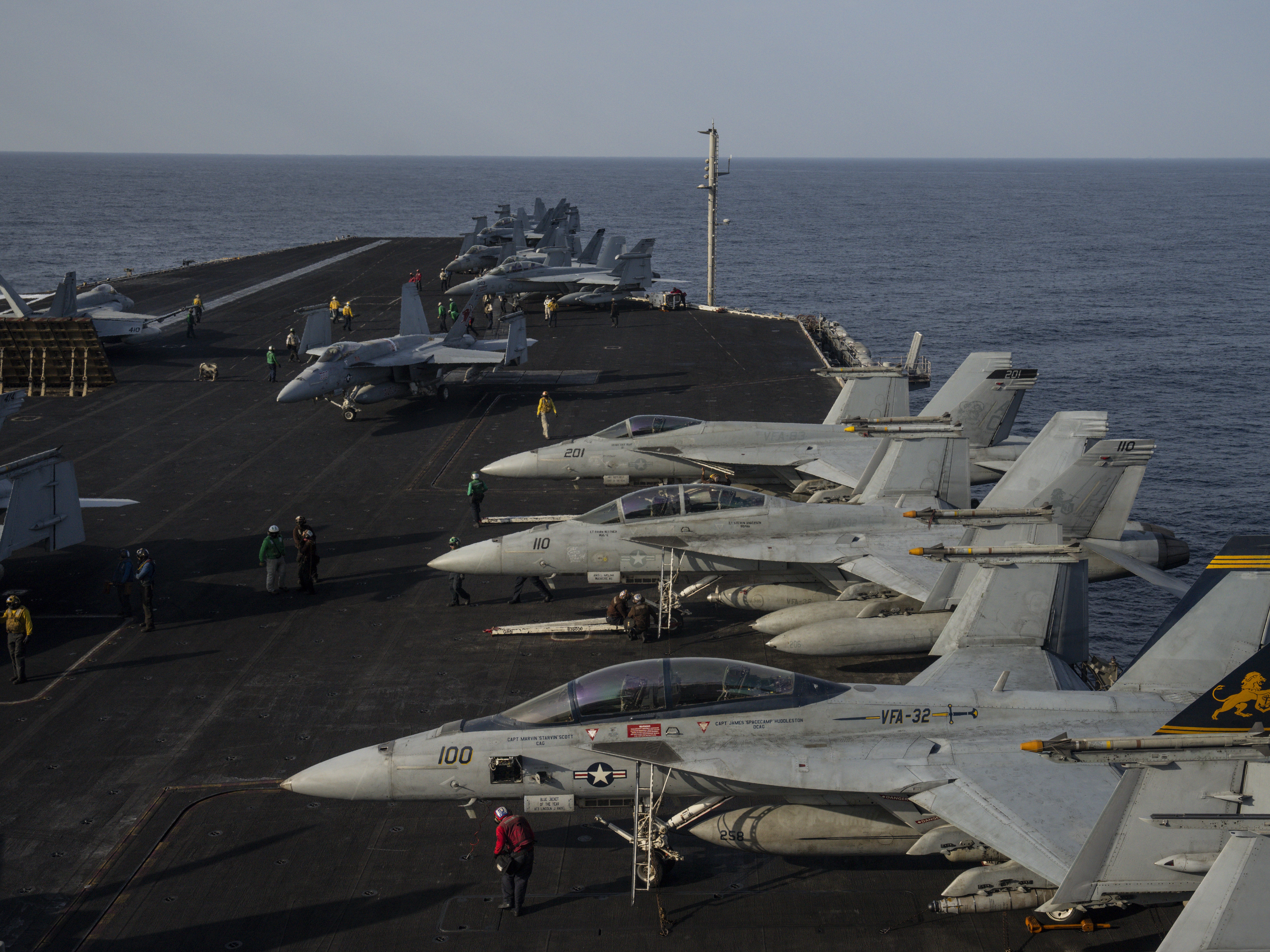 caption: Fighter jets are parked on the deck of the U.S.S. aircraft carrier Dwight D. Eisenhower, also known as the 'Ike', on the south Red Sea, Monday, Feb. 12, 2024. (AP Photo/Bernat Armangue)