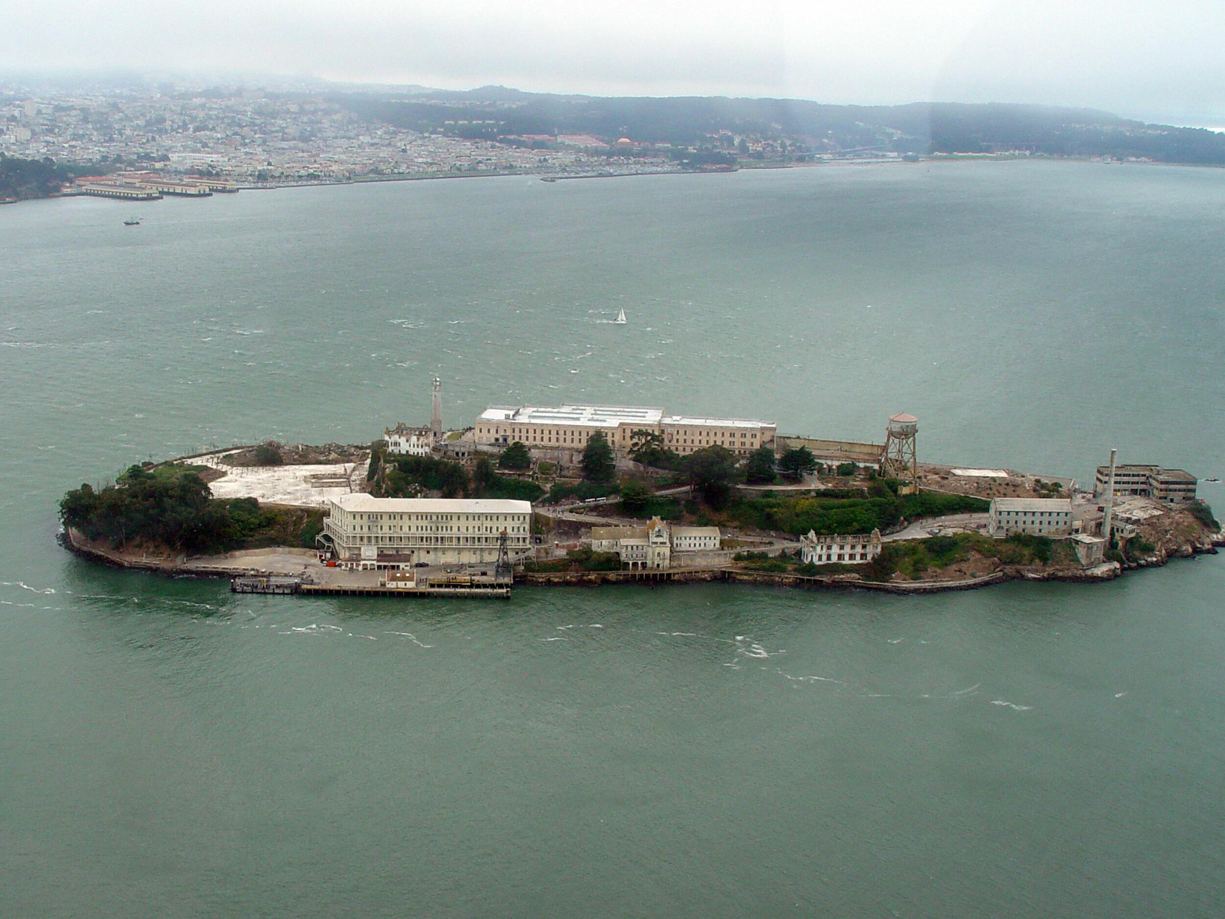 caption: The former federal prison complex on Alcatraz Island is seen in 2005. The site has been operated by the National Parks Service for decades — but President Trump says he is ordering federal agencies to rebuild and expand a penitentiary site on the island in San Francisco Bay.