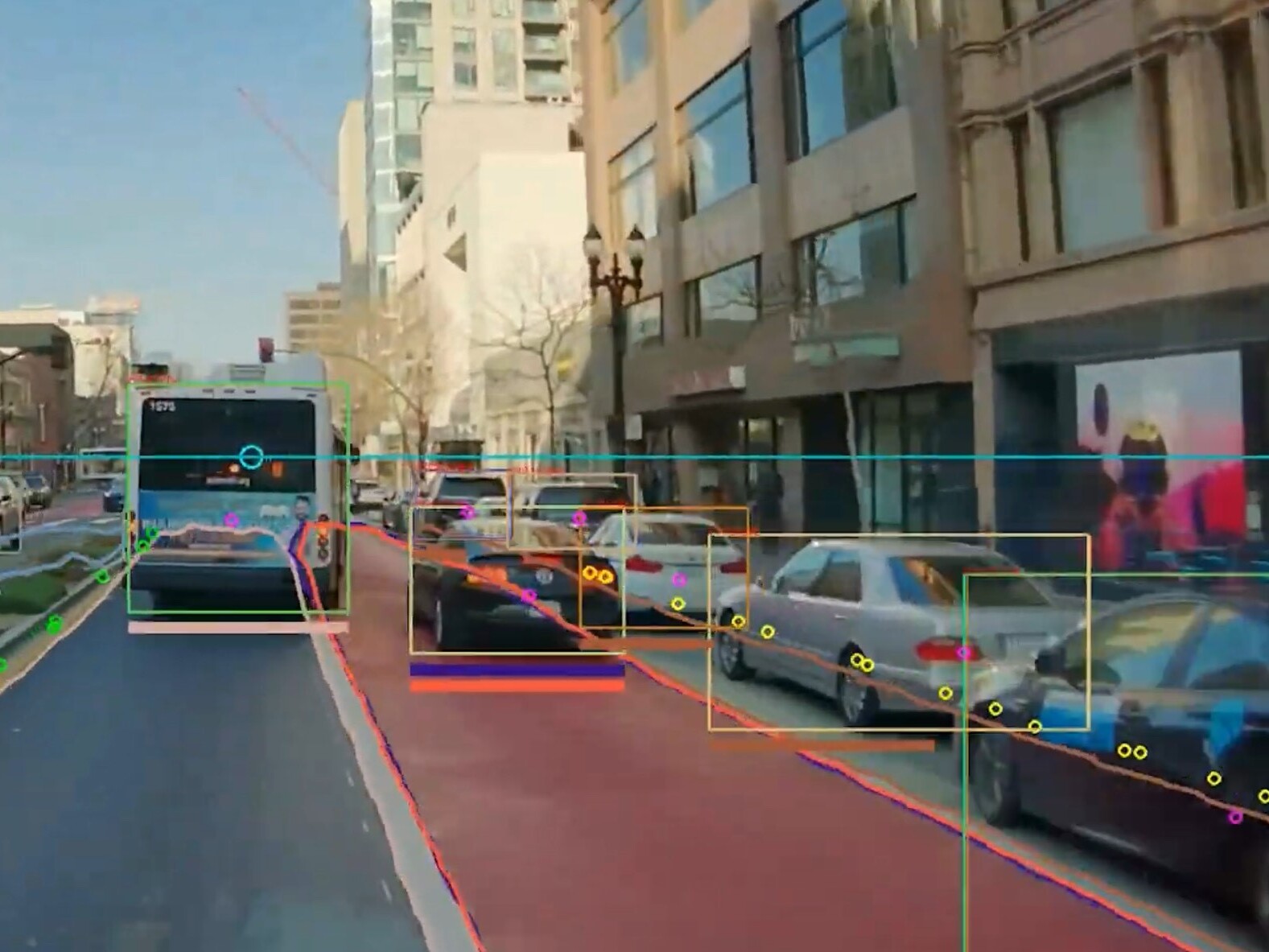 caption: A street in Oakland, Calif., viewed through AI-enhanced cameras from the start-up Hayden AI. Transit agencies across the U.S. are deploying the company's systems to keep bus lanes clear of illegally parked cars.