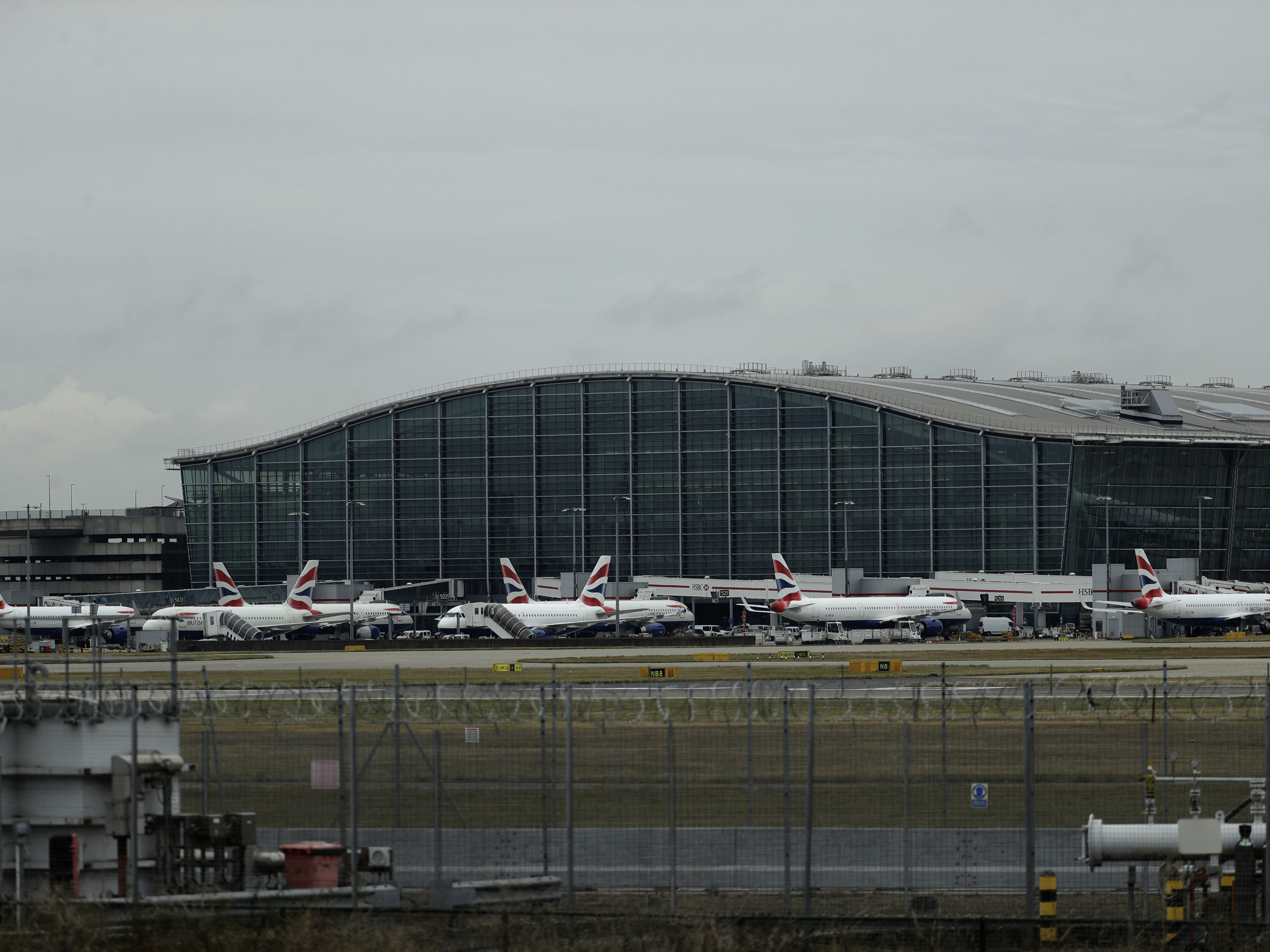 caption: British Airways planes sit parked at London's Heathrow Airport Monday. British Airways says it has had to cancel almost all flights as a result of a pilots' 48-hour strike over pay.