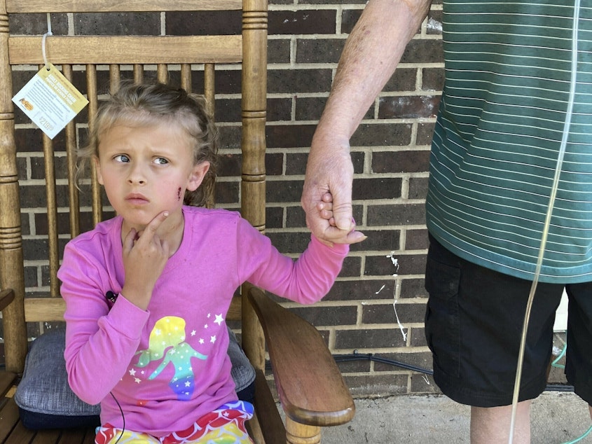 caption: Kinsley White, 6, shows reporters her wound on Thursday in Gastonia, N.C.