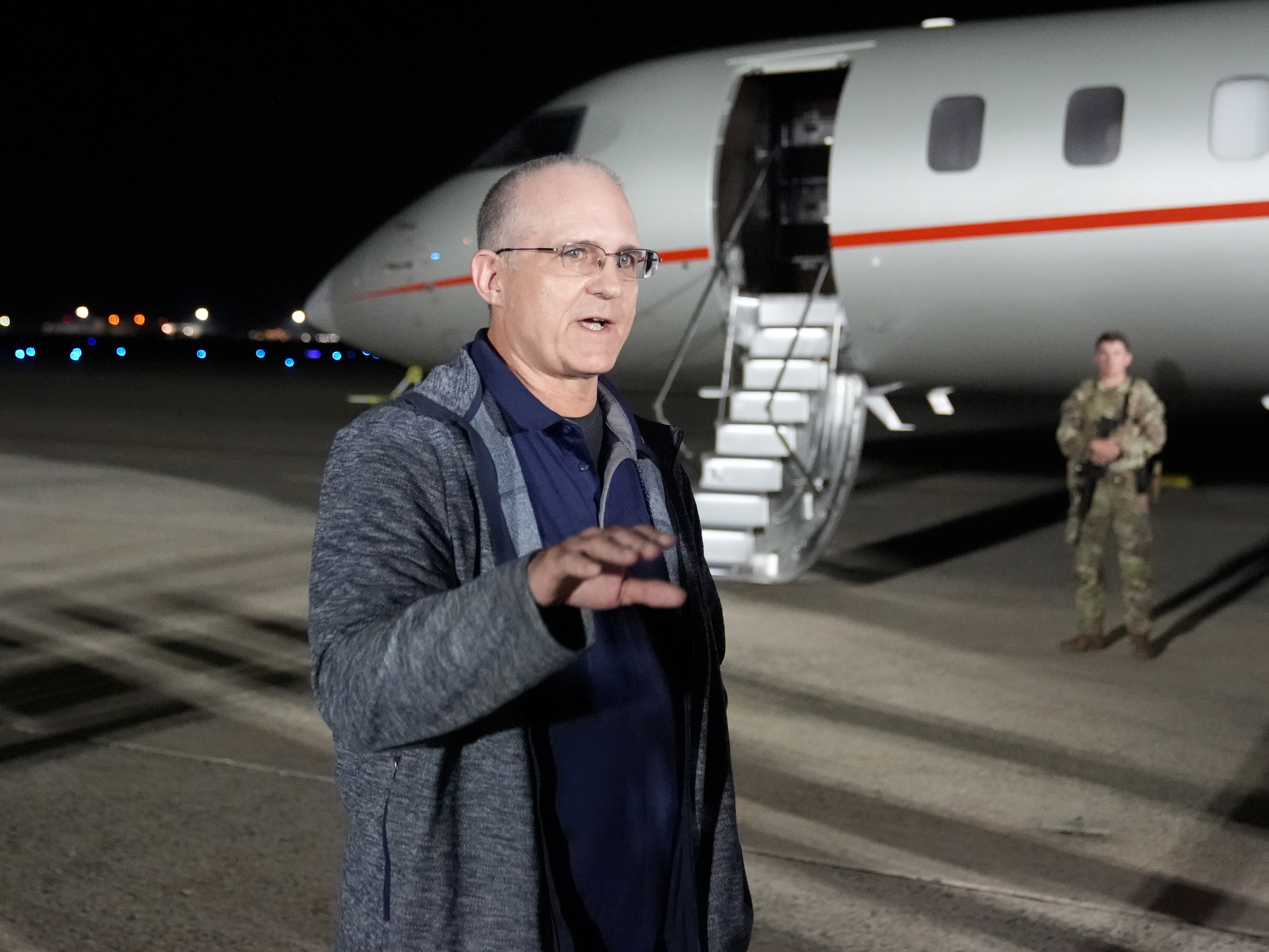 caption: Paul Whelan speaks at Andrews Air Force Base, Md., following his release as part of a 24-person prisoner swap between Russia and the United States, Thursday, Aug. 1, 2024.