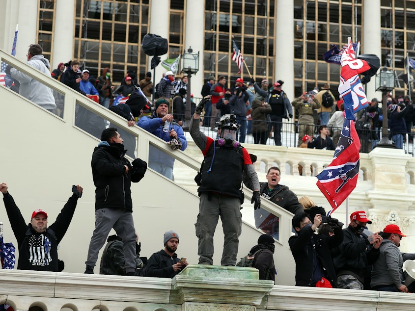 caption: Rioters gather outside the U.S. Capitol on Wednesday in Washington, D.C.