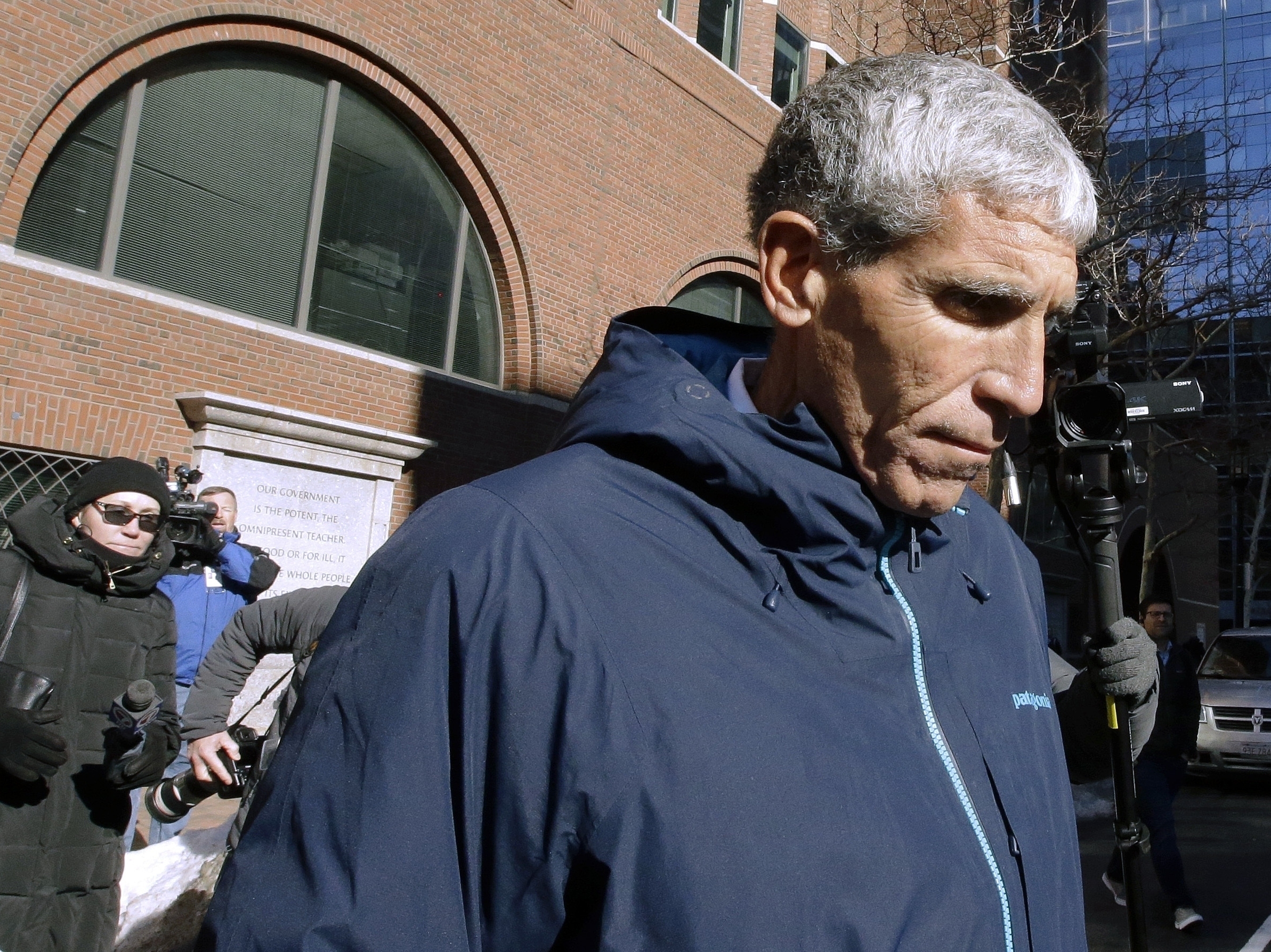 caption: Rick Singer departs federal court in Boston in March 2019 after pleading guilty to charges in a nationwide college admissions bribery scandal. Singer is scheduled to be sentenced Wednesday afternoon in Boston.