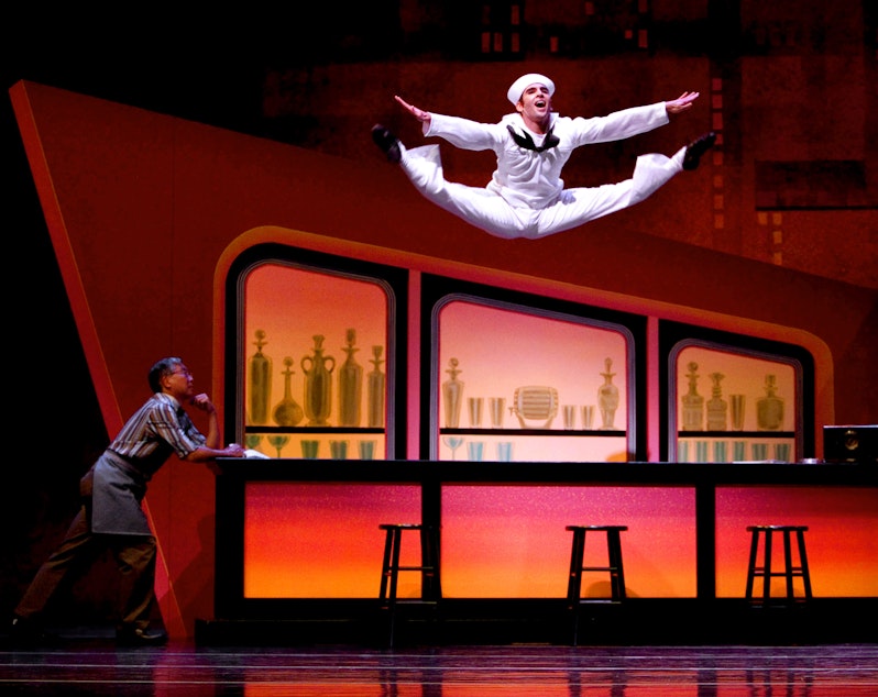 caption: Pacific Northwest Ballet's Jonathan Porretta in Jerome Robbins' "Fancy Free," with Glen Kawasaki at left