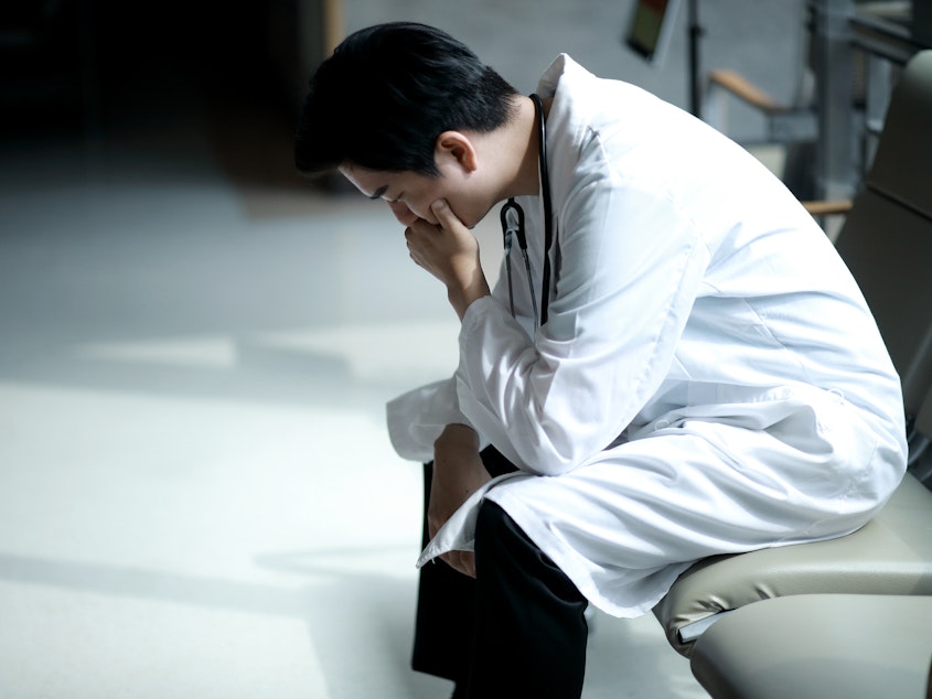 caption: Doctors who experience burnout are prone to cut back on hours or quit practicing medicine. This costs the health care system billions, new research finds.