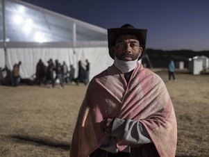 caption: George Baraina Dos Santos, photographed at a camp for the homeless in Standfontein, Cape Town, South Africa. The city's homeless population were broght here by the government as part of the city's corona virus response, but many say they felt safer on the streets.