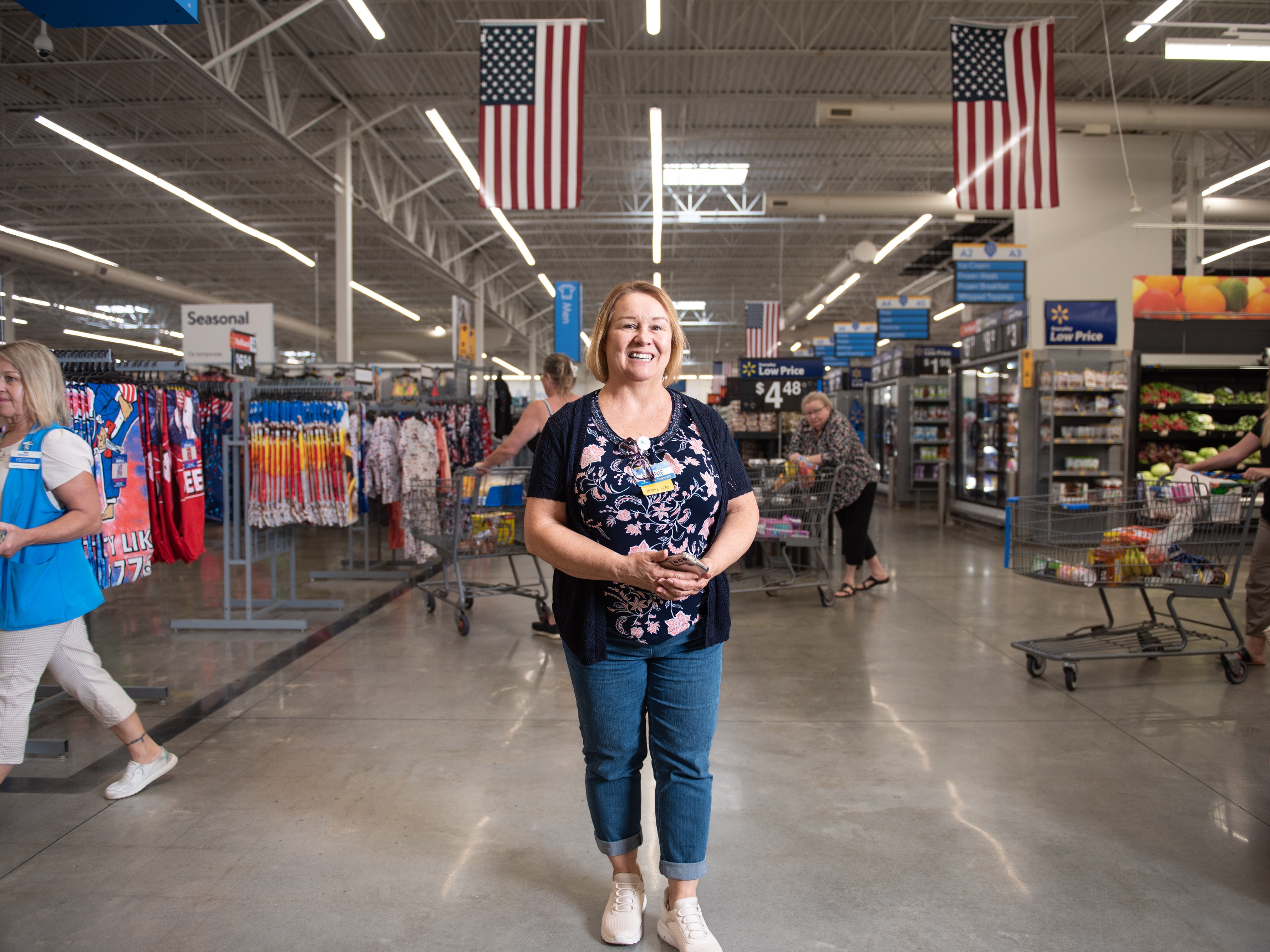 caption: Bonnie Boop is now a people lead at Walmart in Huntsville, Ala. She received college credit for a company training program, graduating with a bachelor's degree last year. 