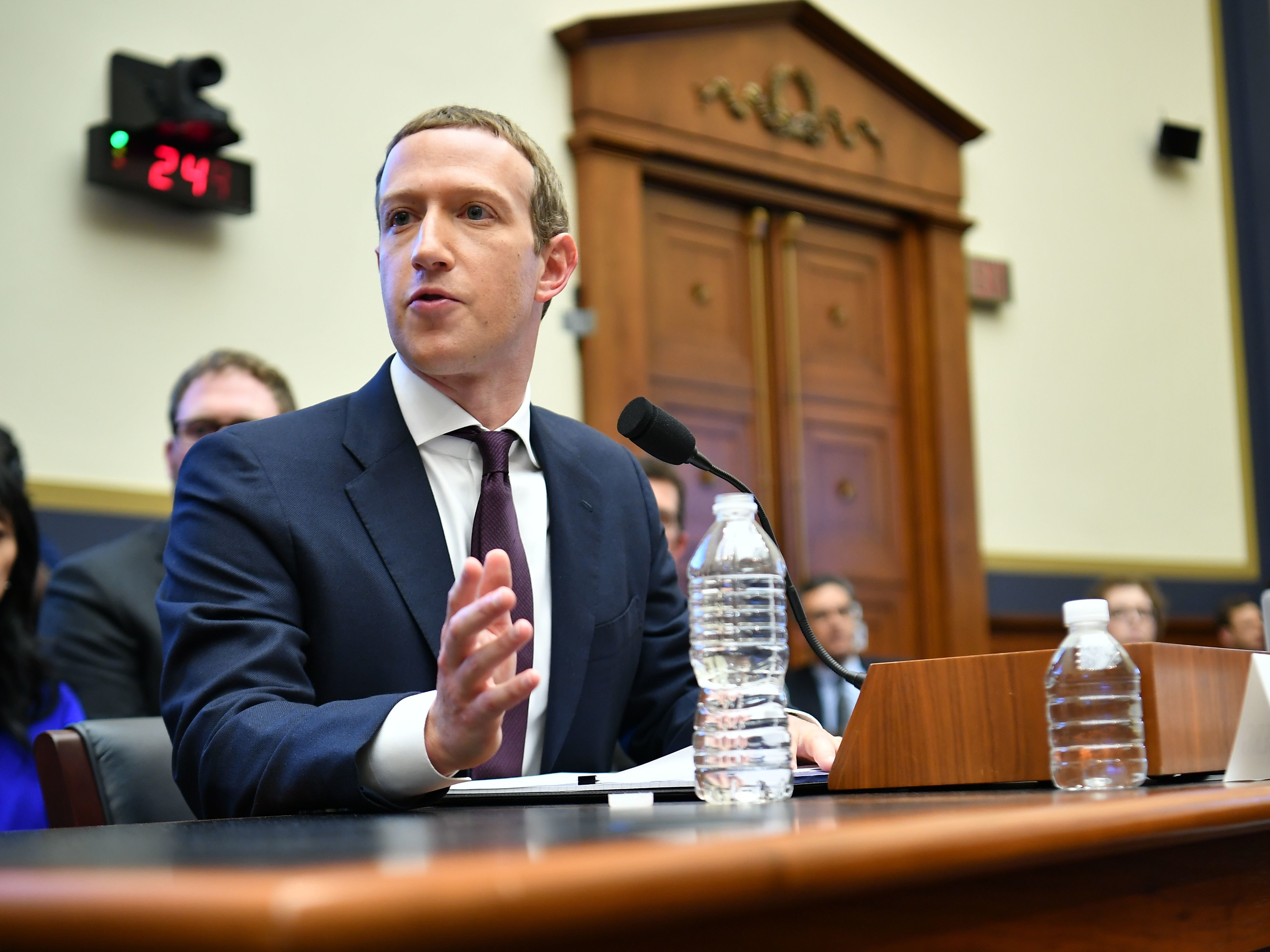 caption: Facebook Chairman and CEO Mark Zuckerberg testifies before the House Financial Services Committee on Wednesday. Two days later, Zuckerberg's social media giant announced it is launching a section of its site specifically dedicated to news.