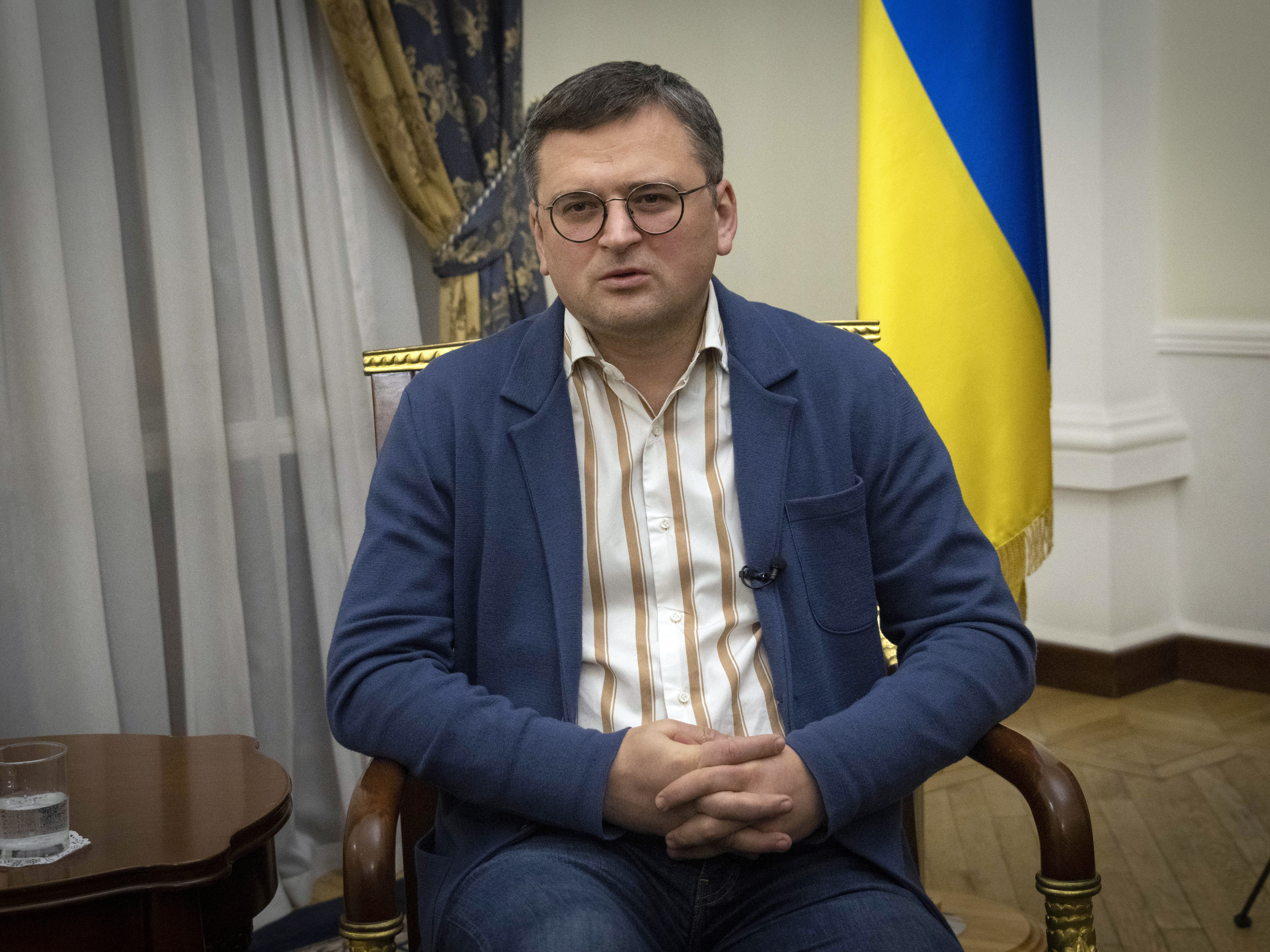 caption: Ukraine's Foreign Minister Dmytro Kuleba talks during an interview with The Associated Press in Kyiv on Monday.