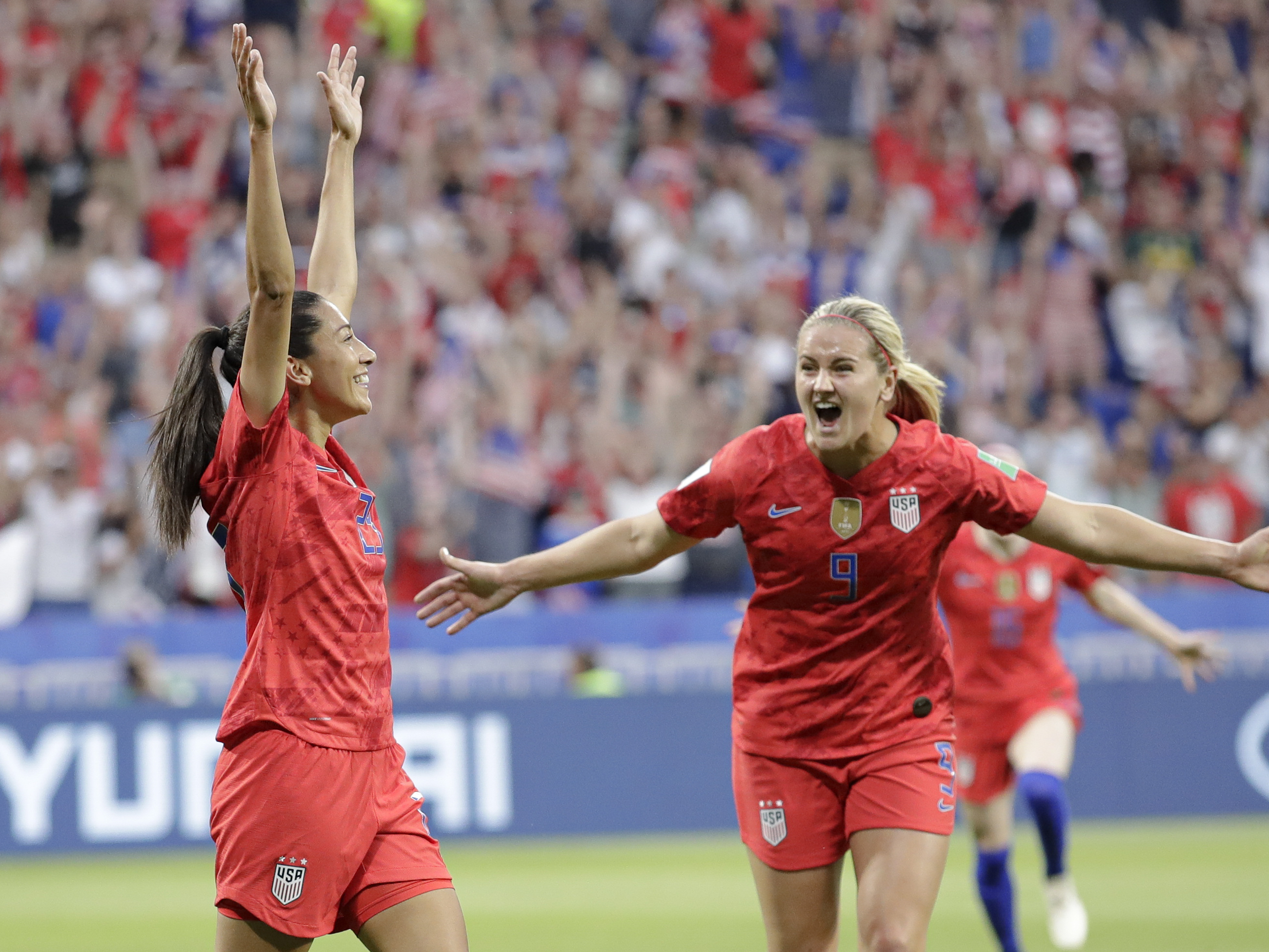 caption: Christen Press (left) celebrates after scoring the U.S.'s first goal during the Women's World Cup semifinal against England. The U.S. won 2-1.