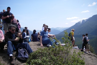 caption: Hikers at Rattlesnake Ledge. The number of visitors to this trail have been increasing over the last years.