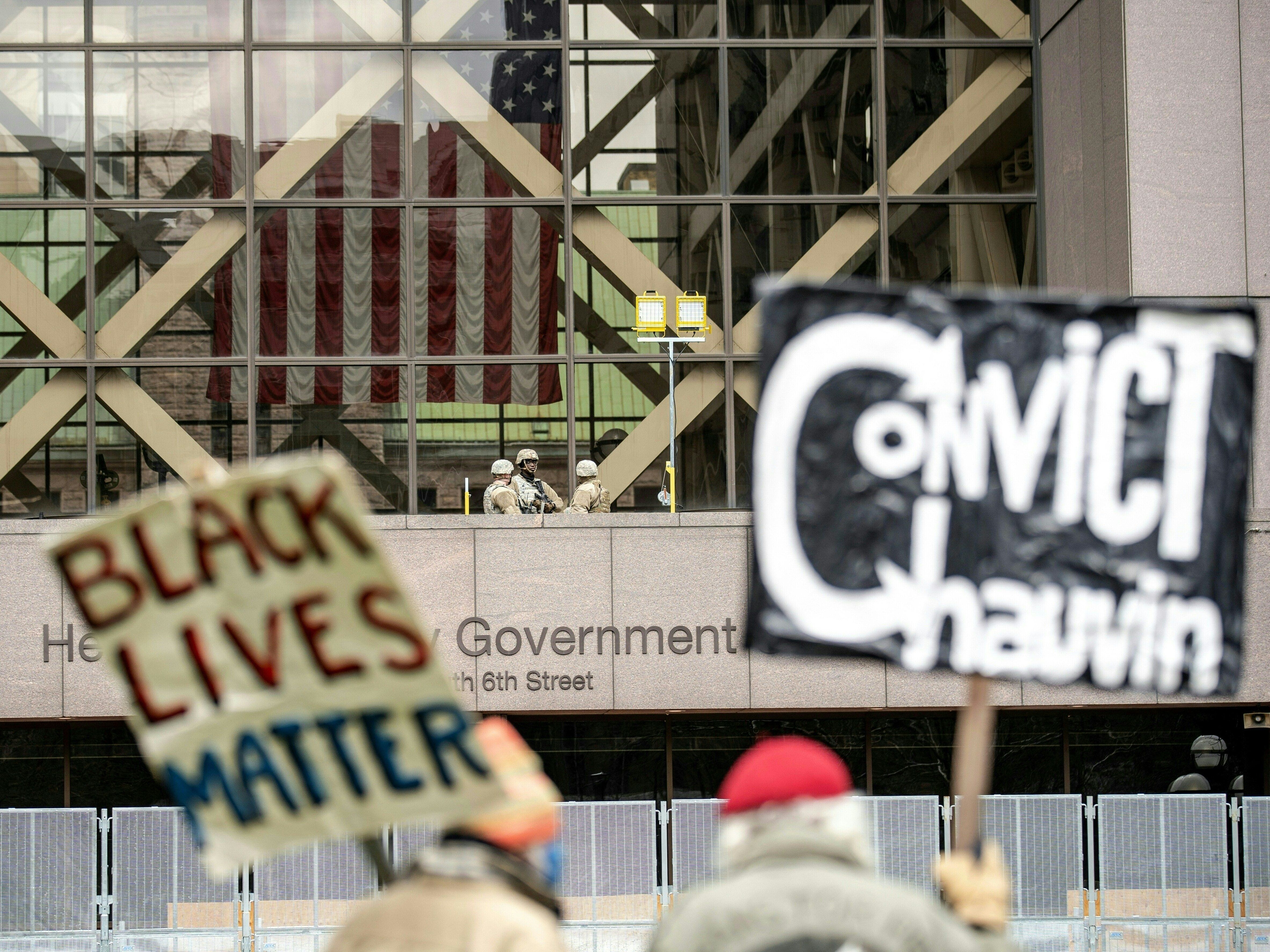 caption: People wait for the verdict in Derek Chauvin's trial over the death of George Floyd outside the Hennepin County Courthouse in Minneapolis on Tuesday.