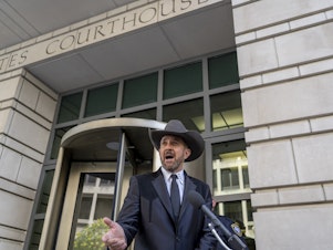 caption: Couy Griffin, a county commissioner in Otero County, New Mexico, speaks on June 17 outside federal court in Washington, D.C., where he was convicted of entering a restricted area during the Jan. 6 riot at the Capitol.