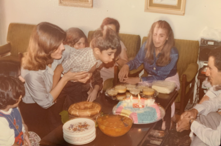 caption: Zaki Hamid blows out the candles on his sixth birthday cake at his family's apartment in Amman, Jordan. Hamid's family moved to the West Bank from Palestine in 1948. The family then moved to Jordan after the Six-Day War in 1967.