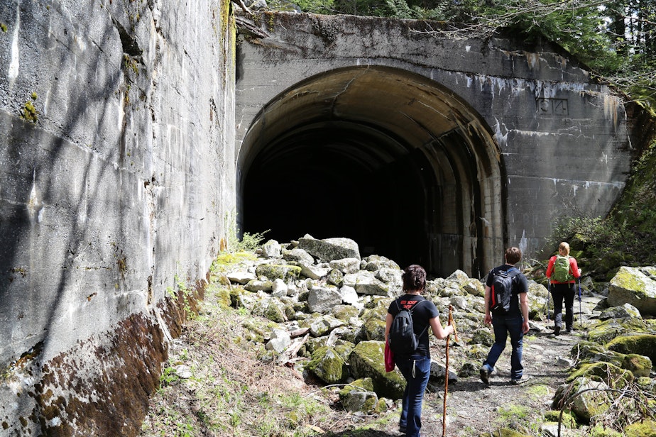 caption: A group of hikers on the Iron Goat Trail in Washington.