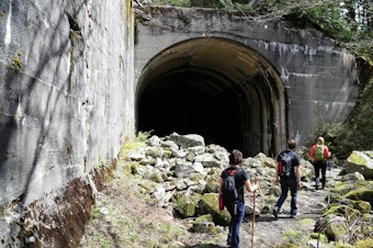 caption:  A group of hikers on the Iron Goat Trail in Washington.
