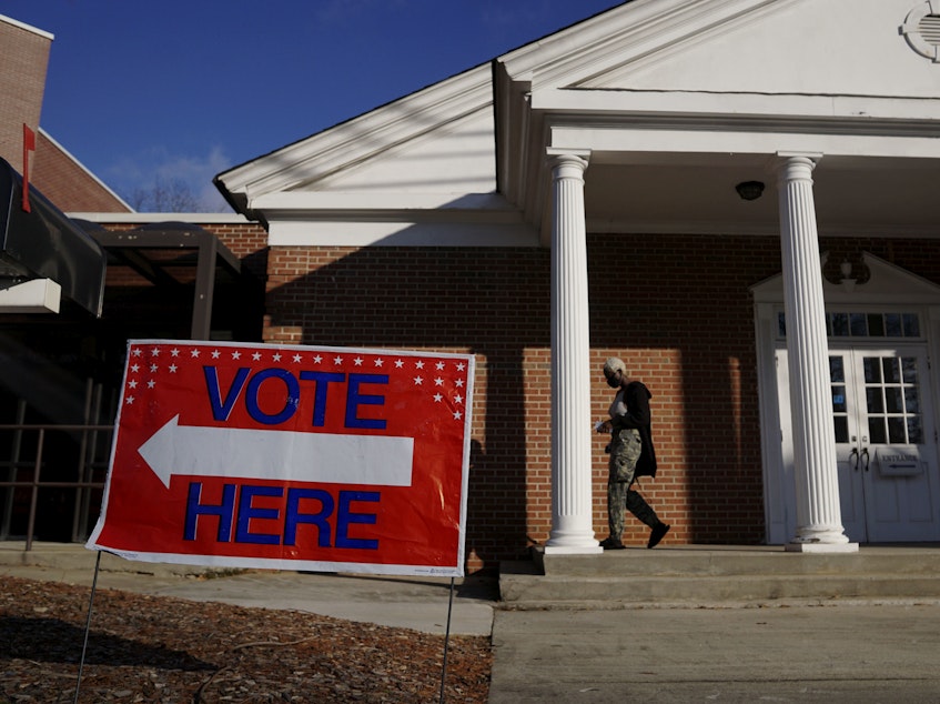 caption: Voters enter a polling station at the Zion Baptist Church on Jan. 5 in Marietta, Ga. Black churches have often played a role in mobilizing their congregants to vote.